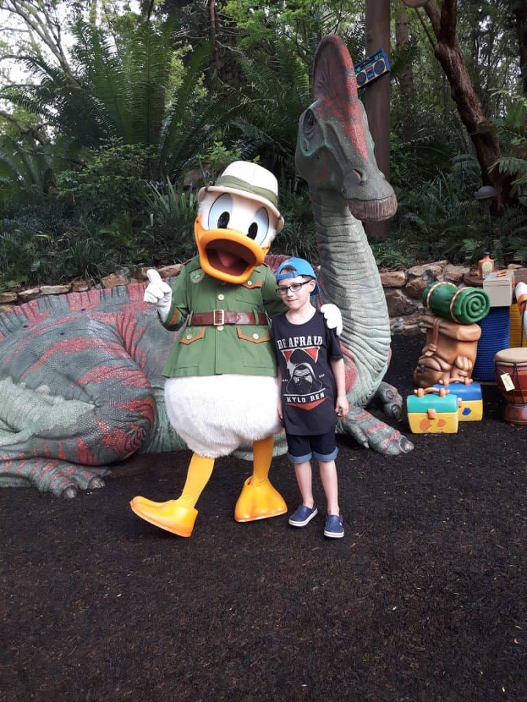 Boy hugging Donald Duck