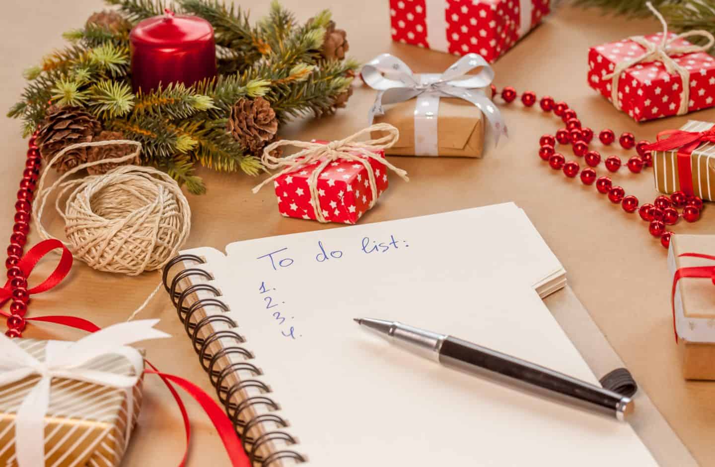 to do list among christmas presents on craft background