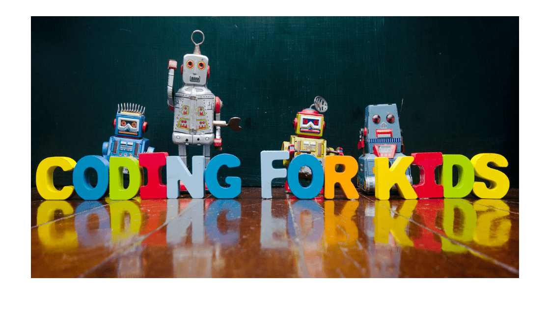 Vintage toy robots on a wooden floor with colorful letter blocks spelling 'CODING FOR KIDS,' conveying an engaging approach to children's programming education.