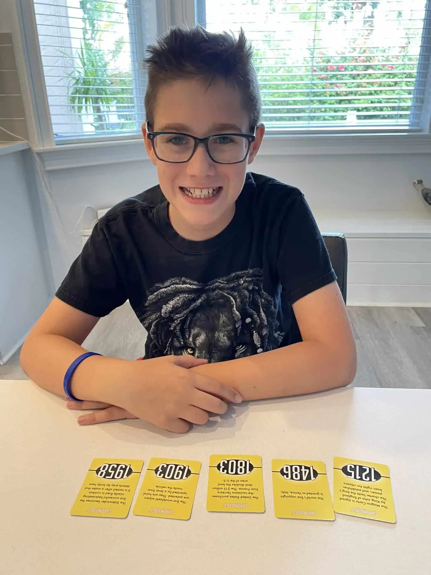 Boy playing chronology board game