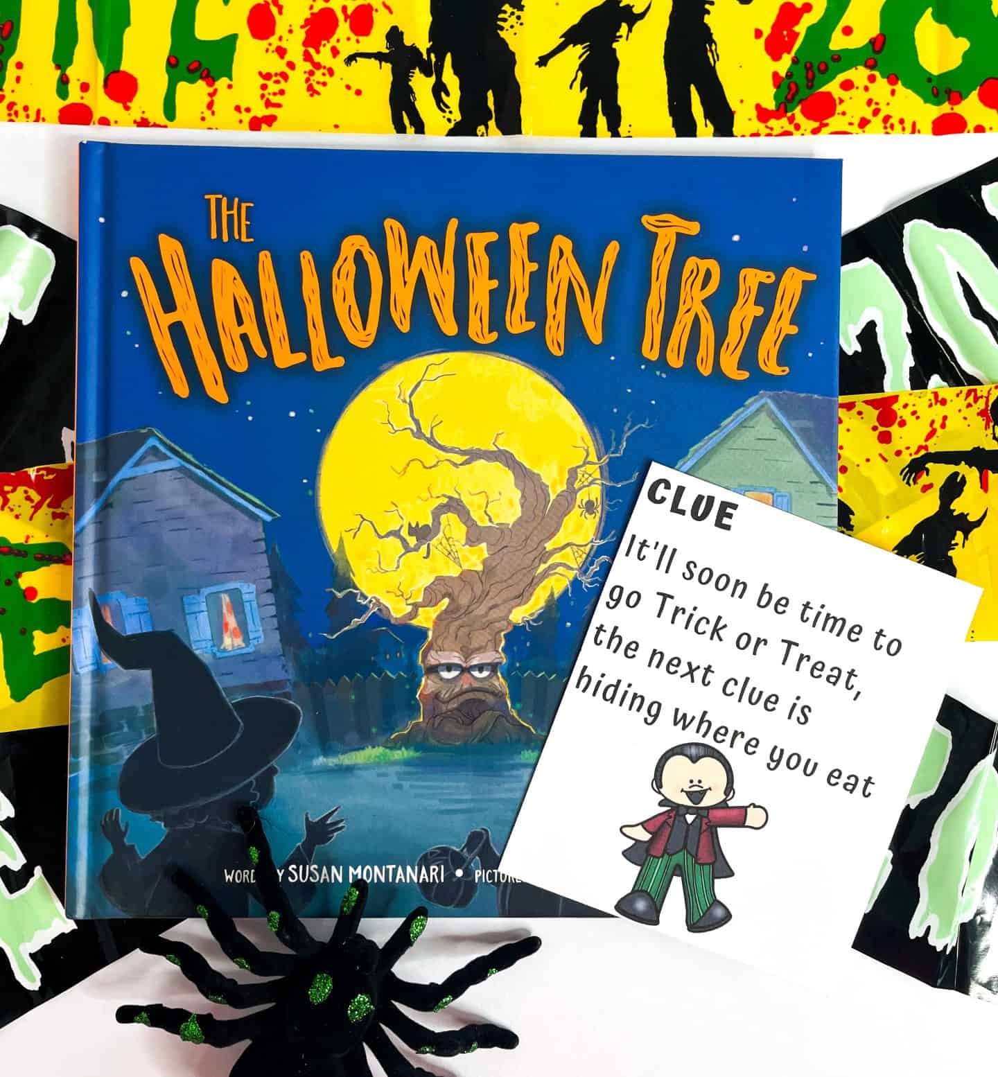 HALLOWEEN TREASURE HUNT CLUE on top of the halloween tree book