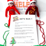 Two elves with a personalized Elf on the Shelf welcome letter and holiday beads