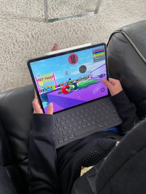 Boy Playing Brainika Math on Roblox on  an Ipad
