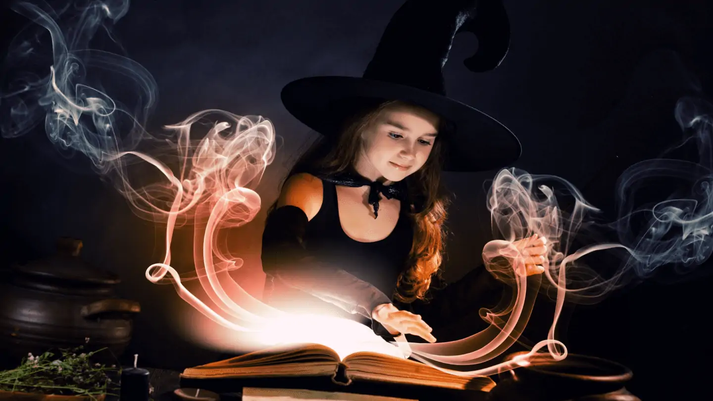 girl wearing a witchs outfit making a spell over a book