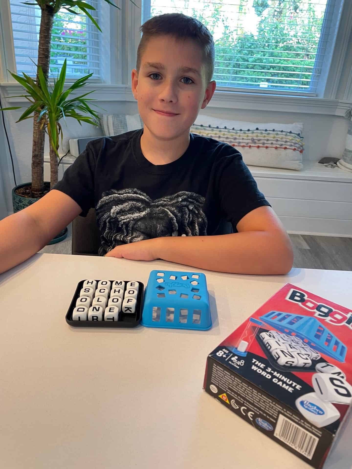 Boy playing Boggle in our homeschool of one