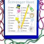 Printable New Year’s Eve scavenger hunt list on clipboard with beads and pencil.