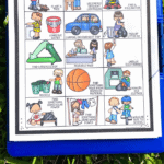 Earth Day scavenger hunt on a blue storage clipboard on the grass. With images of kids recyclying, riding bikes, turning off lights and more. Under are the wrods in green yellow and blue, free earth day scavenger hunt.