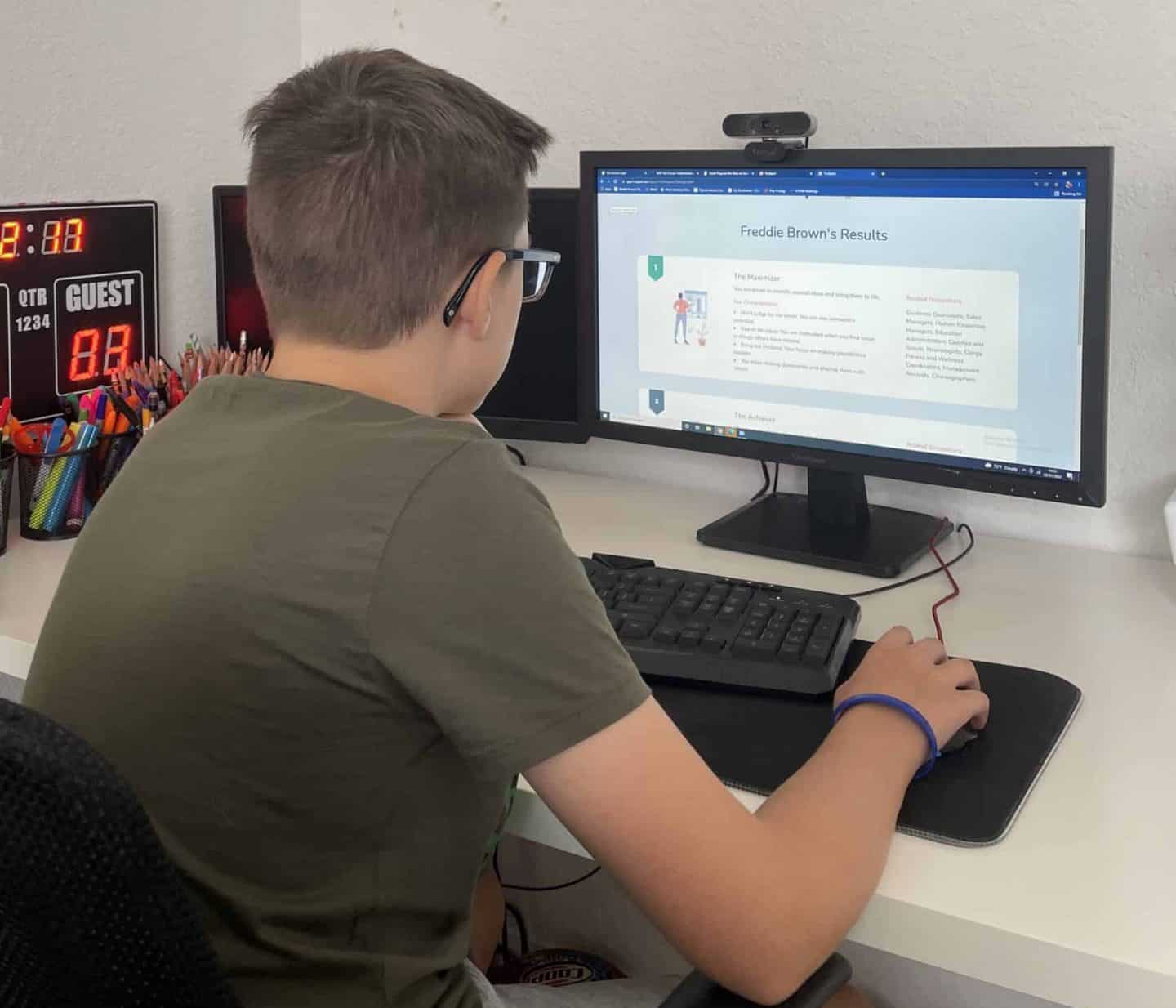 Boy on computer getting career test results from Truspark