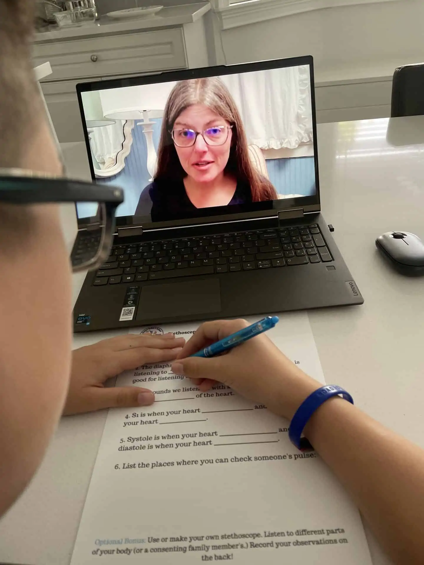 Dr robins lesson on a laptop with a boy watching
