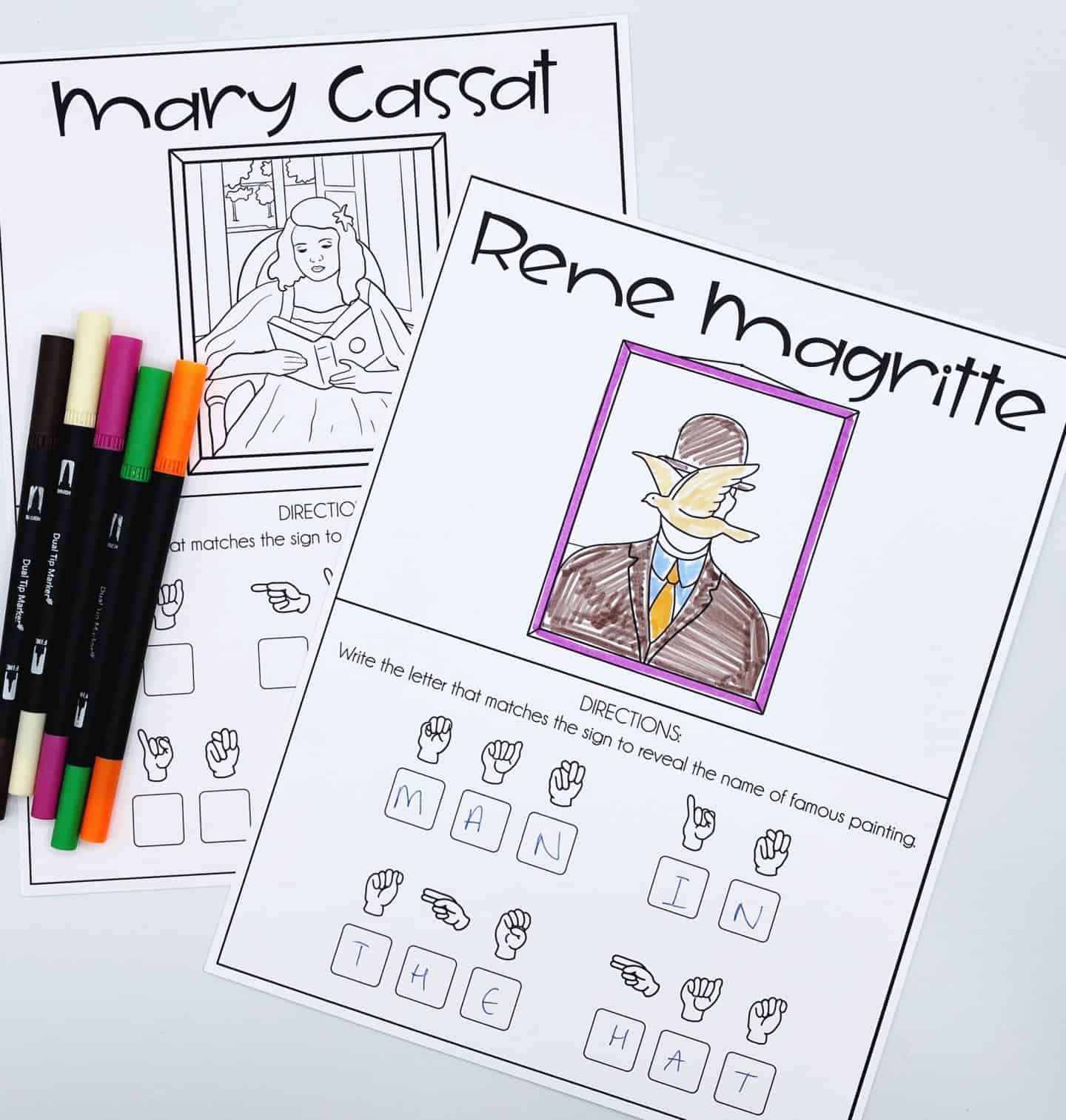 Two ASL worksheets for kids featuring famous paintings. One worksheet is for Rene Magritte’s “Man in the Hat,” fully colored with a bird covering a man's face, and ASL signs below spelling out “MAN IN THE HAT.” The other is an outline of a painting by Mary Cassatt showing a girl reading, with ASL letters below. Several dual-tip markers lie to the side.
