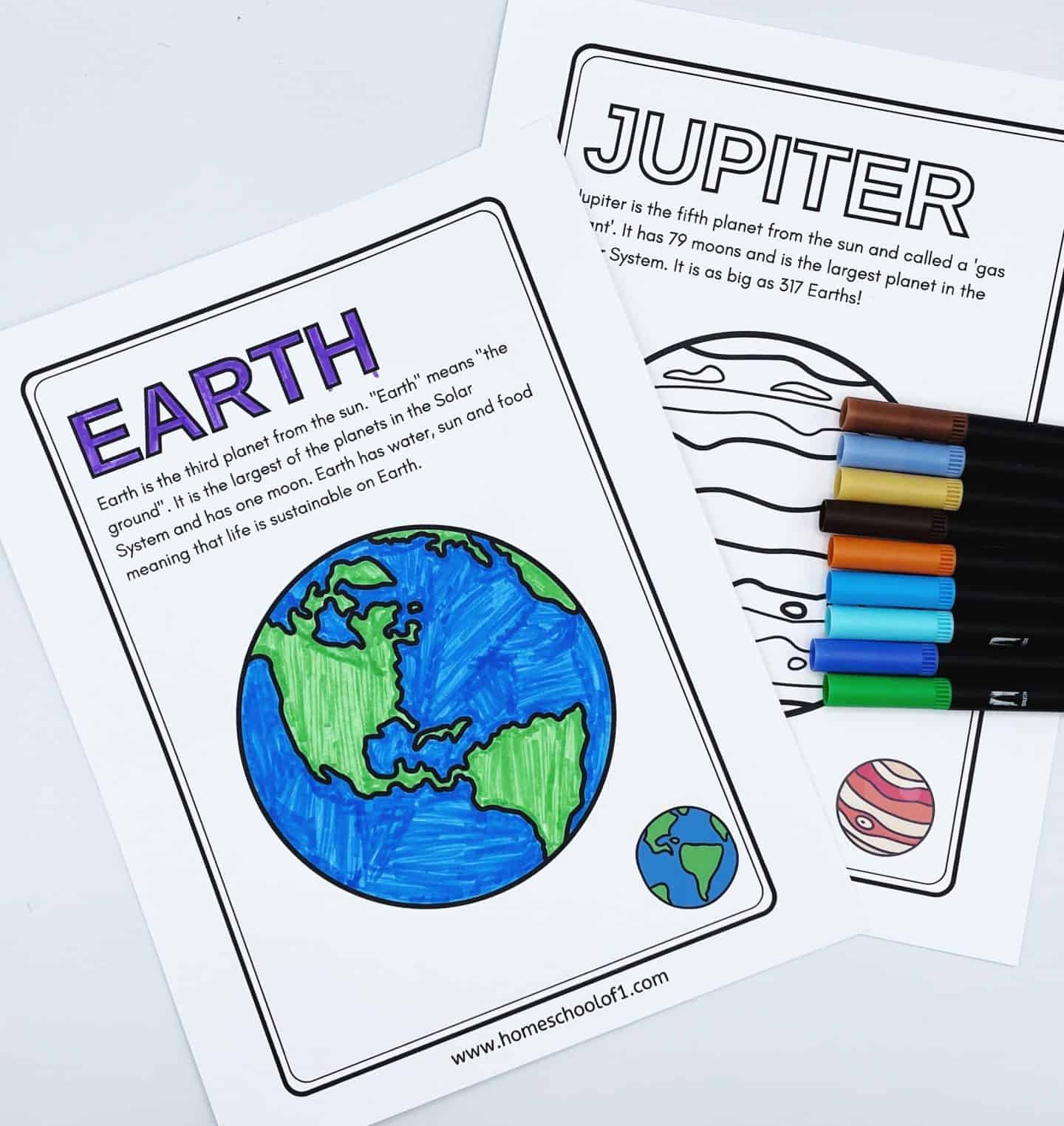 Two educational worksheets about Earth and Jupiter. The Earth page features a colored drawing of Earth with text about its characteristics. The Jupiter page includes a striped planet illustration and text about Jupiter. Colored markers are nearby.
