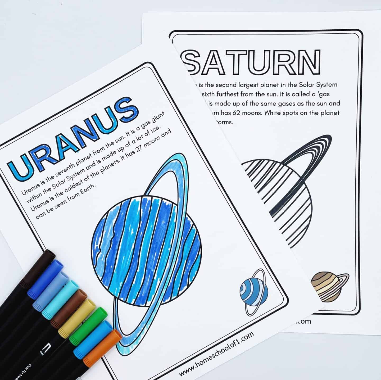 Coloring pages of Uranus and Saturn with colored markers beside them. The Uranus page is partially colored with blue shades. Both pages include educational information about the planets.
