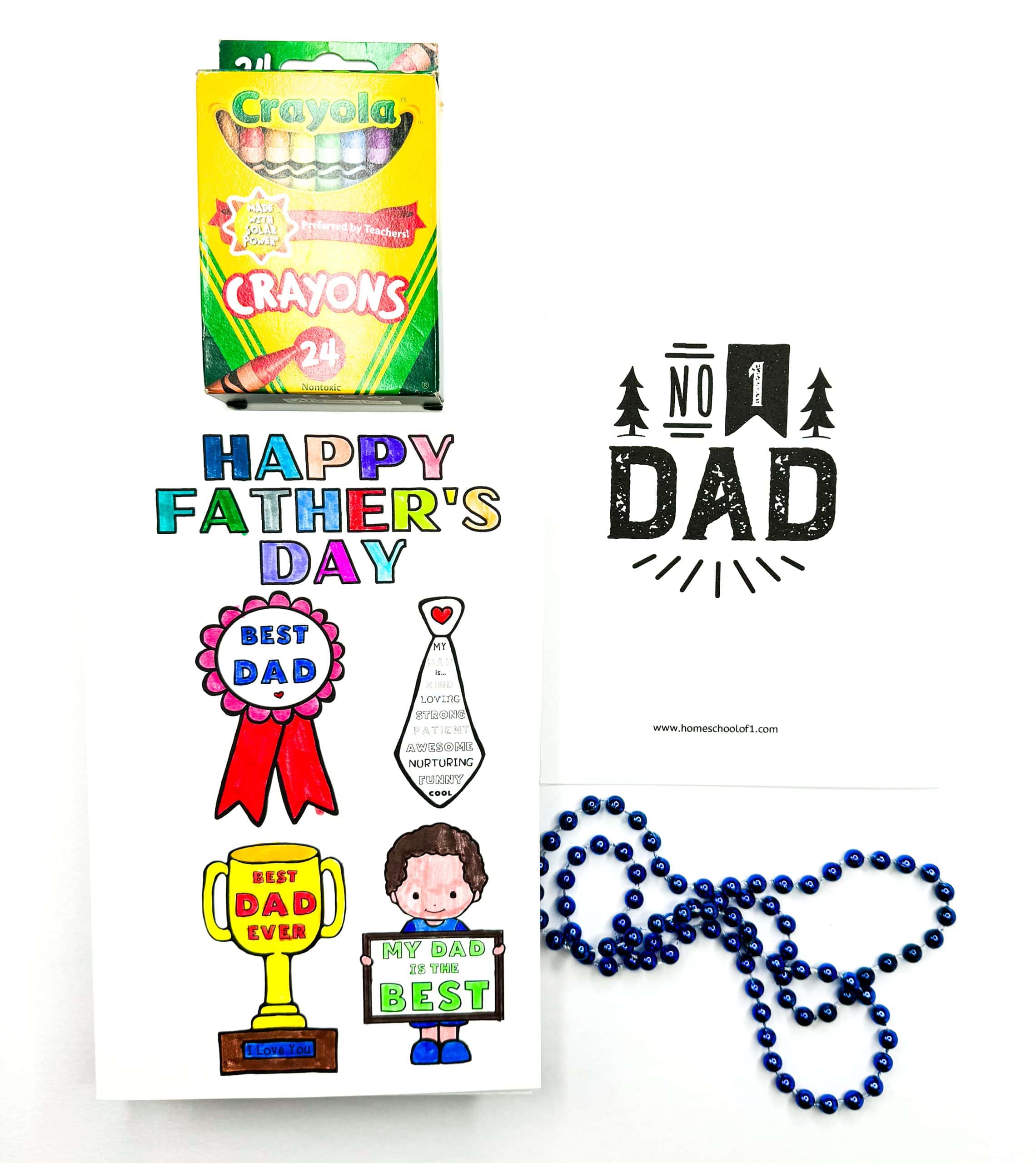 Colorful printable Father's Day card decorated with hand-colored designs, including a “Best Dad” ribbon, a tie with positive traits, a trophy labeled “Best Dad Ever,” and a child holding a “My Dad is the Best” sign. Crayola crayons, a “No. 1 Dad” sign, and blue beaded necklace are included in the setup.

