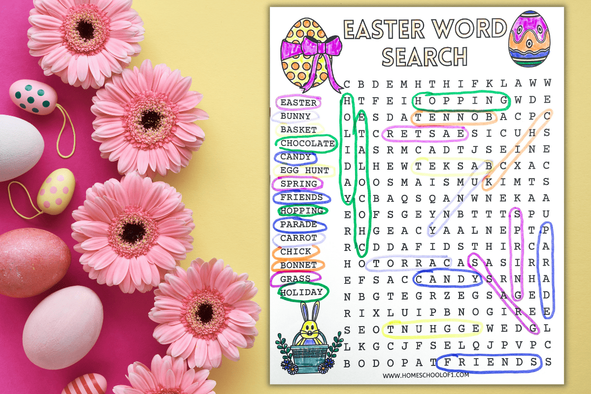 Festive flat lay featuring a completed Easter word search printable on a pastel background with pink daisies and decorative Easter eggs. The word search includes terms like “basket,” “chocolate,” and “egg hunt,” with each found and circled in bright colors. The top of the sheet reads “Easter Word Search”