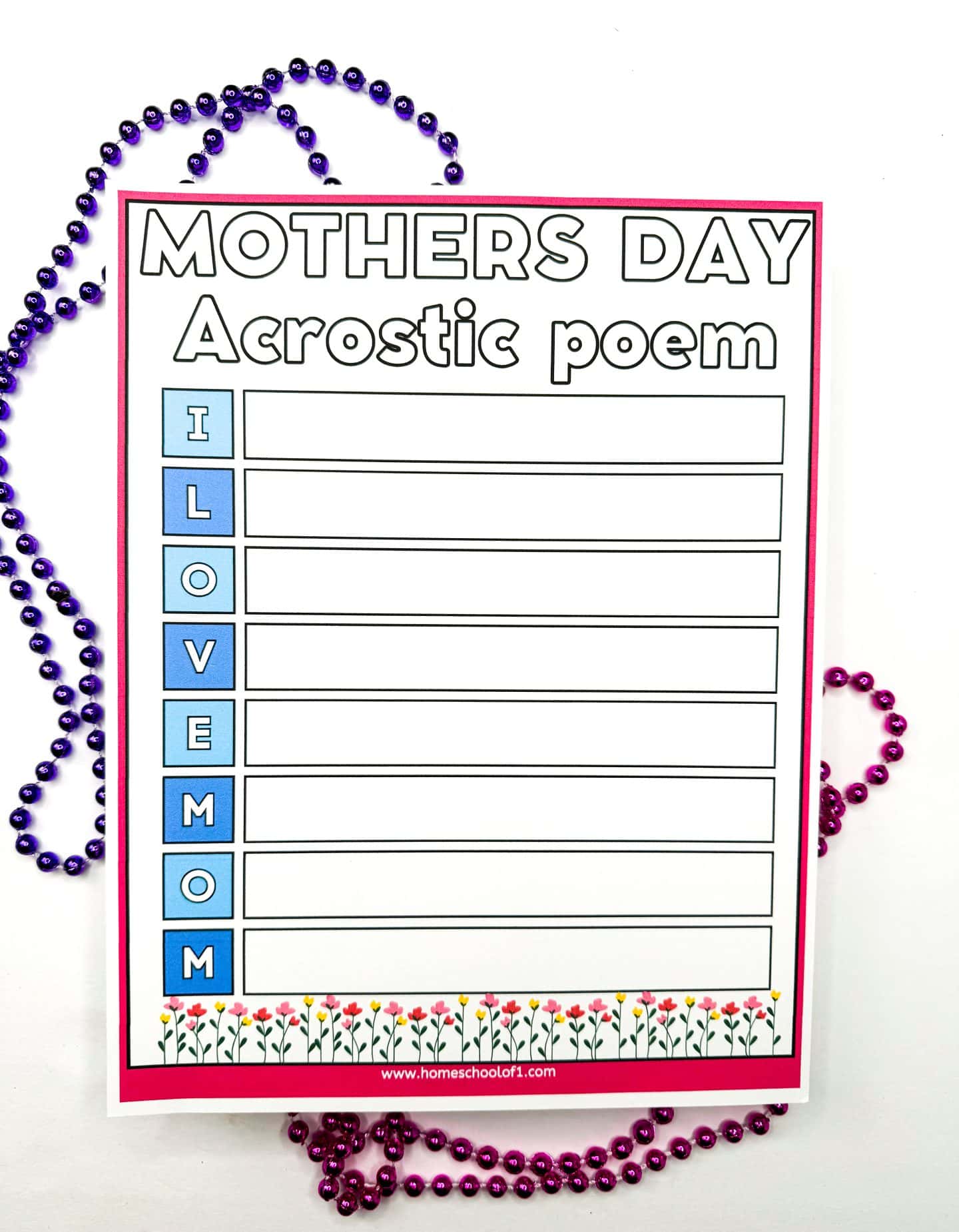 Mother’s Day acrostic poem printable worksheet for kids, featuring the vertical phrase “I LOVE MOM” in blue blocks. Each letter has a blank line beside it for children to write a poem, with floral borders at the bottom and surrounded by purple and pink bead necklaces.
