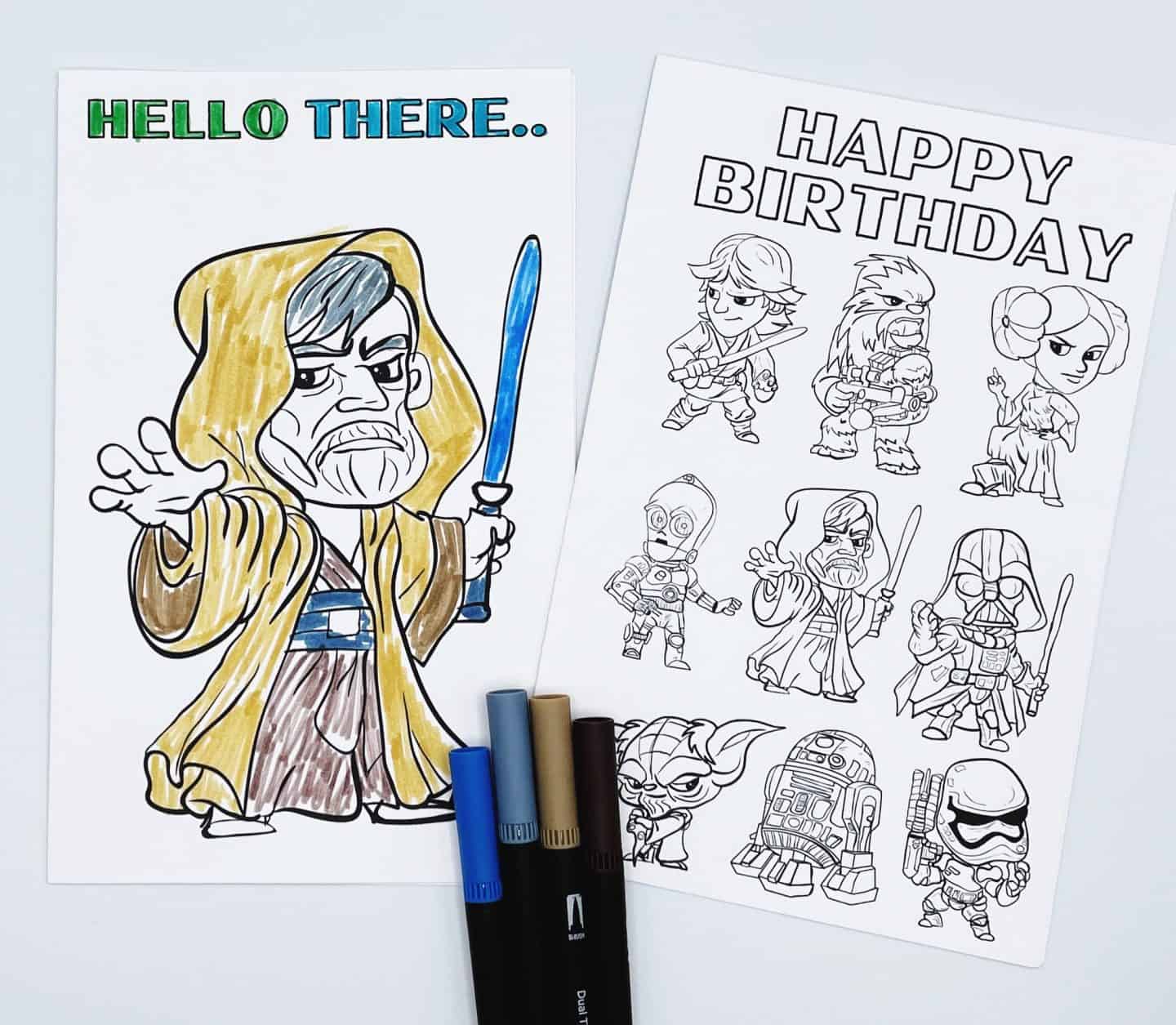 "Hello There" Obi-Wan Kenobi card colored, alongside an uncolored "Happy Birthday" Star Wars character card featuring Yoda, Stormtrooper, Darth Vader, and others, with colored markers.