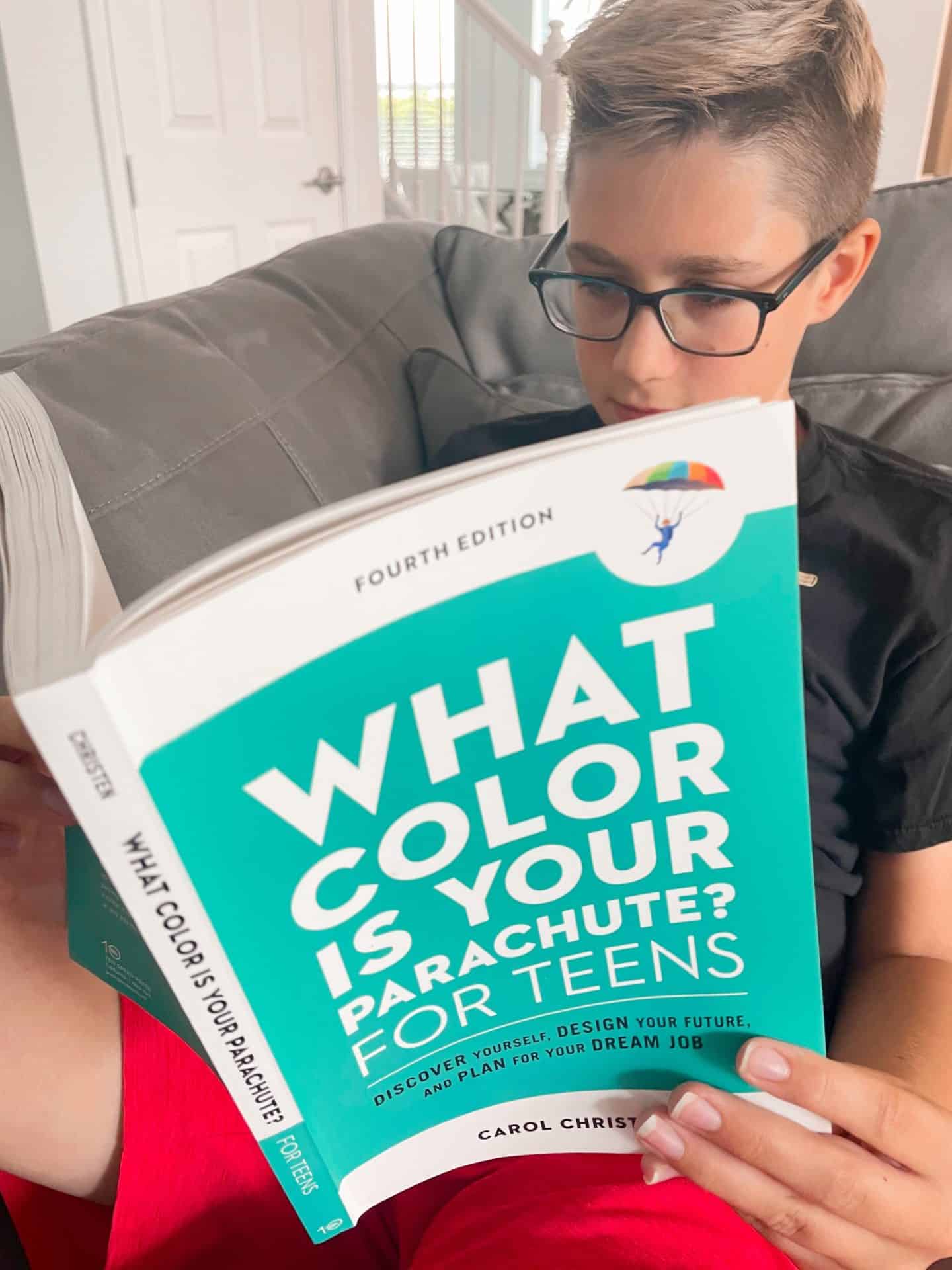 boy reading what color is your parachute for teen book