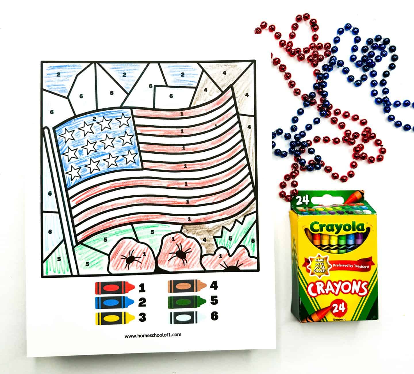 Stars and Stripes American Flag color by number printable completed with 6 different colors and blue and red beads and crayola crayons on the side for decoration. 