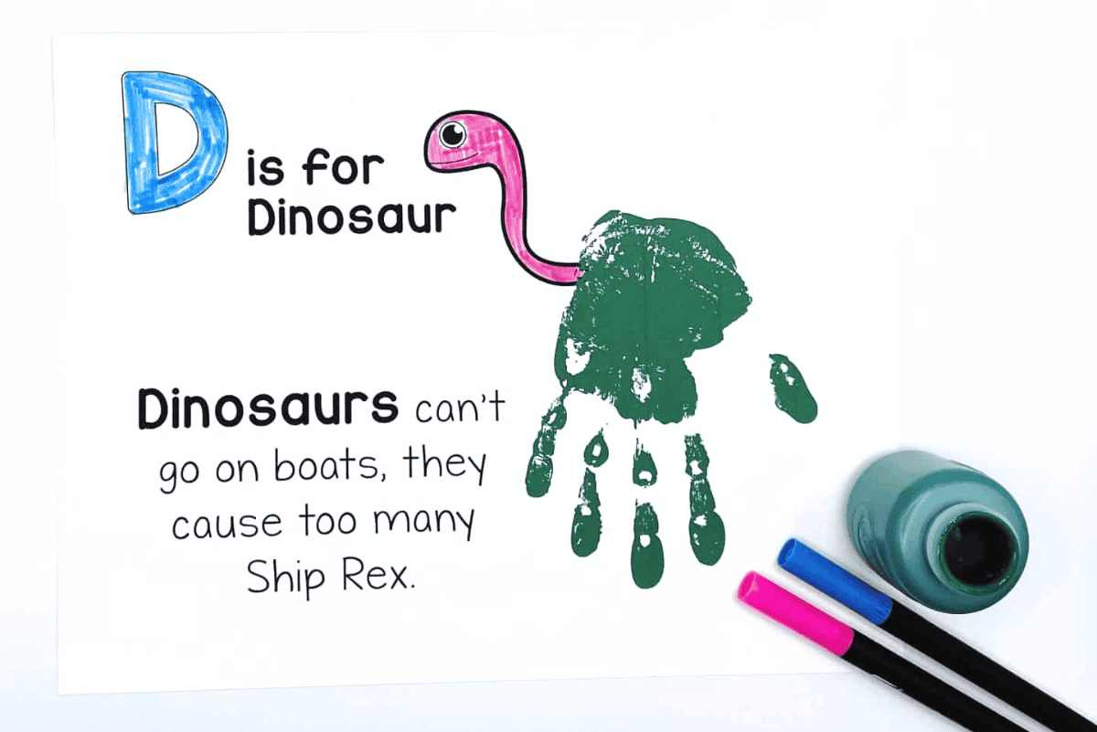 “D is for Dinosaur” handprint art with a painted green hand forming a dinosaur body, paired with a fun pun: “Dinosaurs can't go on boats, they cause too many Ship Rex.”