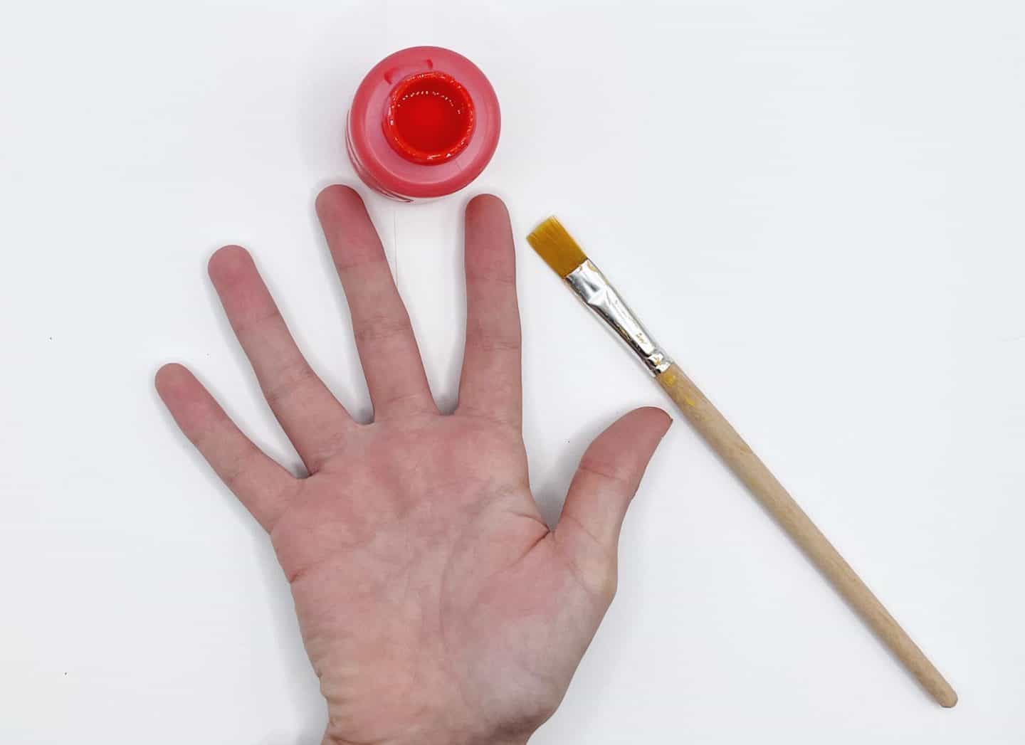 hand and red paint