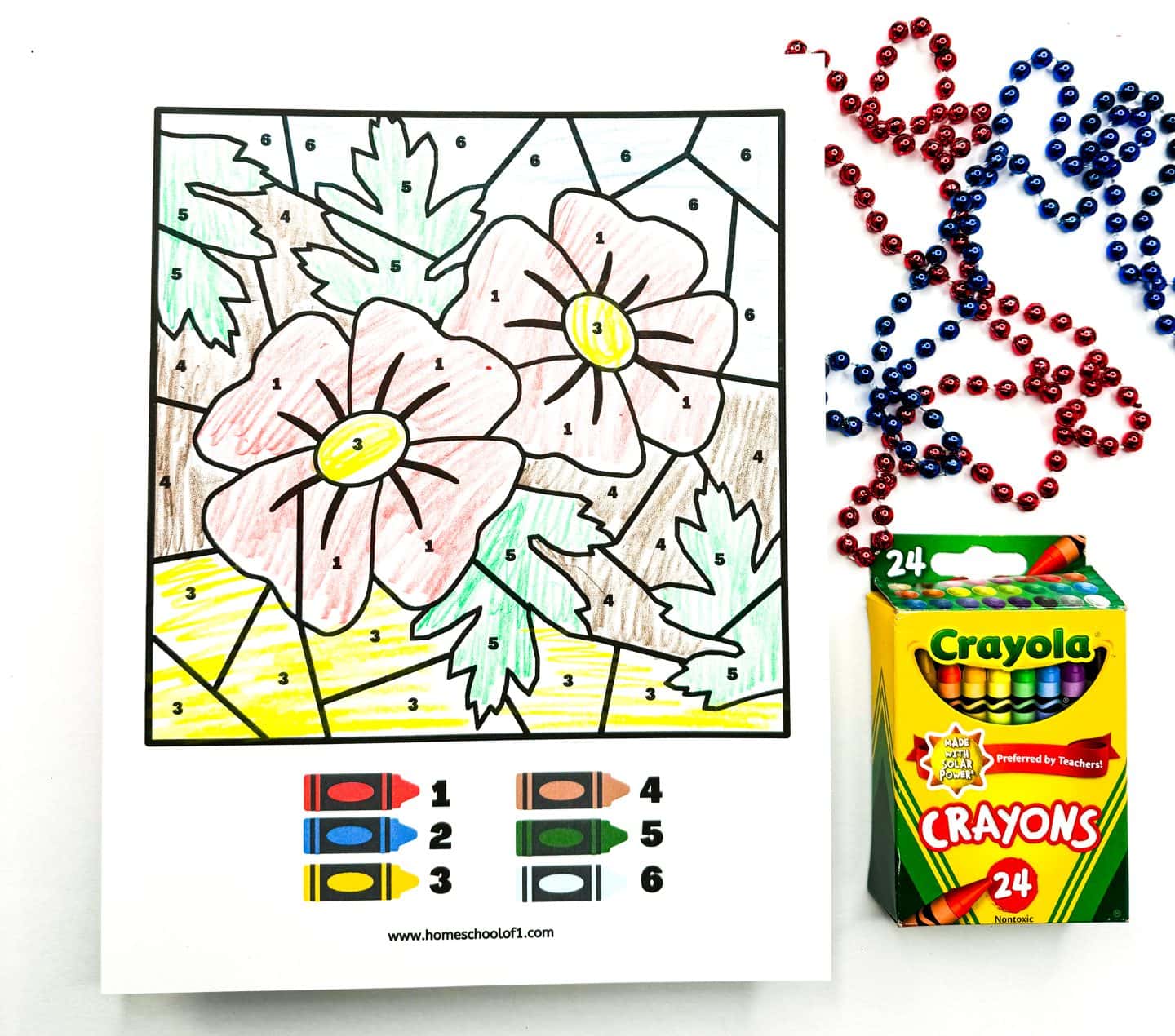 2 poppies are featured on this patriotic color by number printable. completed with 6 different colors and red and blue beads and crayola crayons are on the side for decoration. 