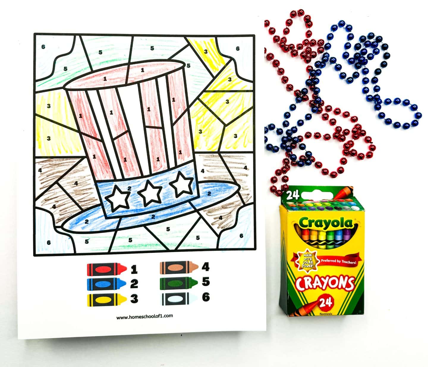 uncle sams hat color by number completed with 6 colors and crayola crayons and red and blue beads are on the side for decoration. 
