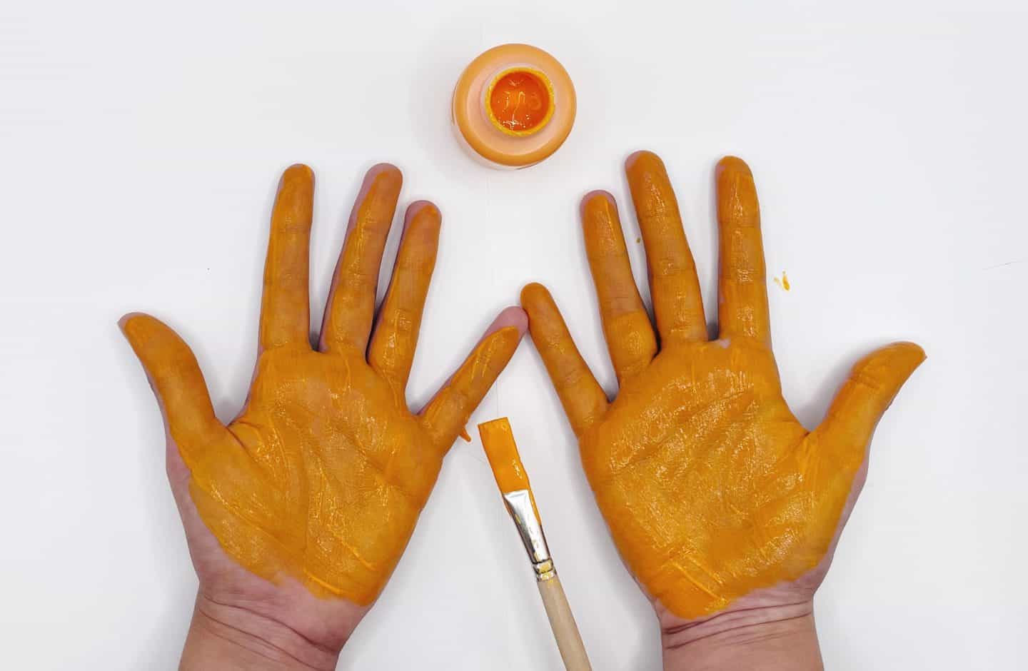 2 orange handprints
