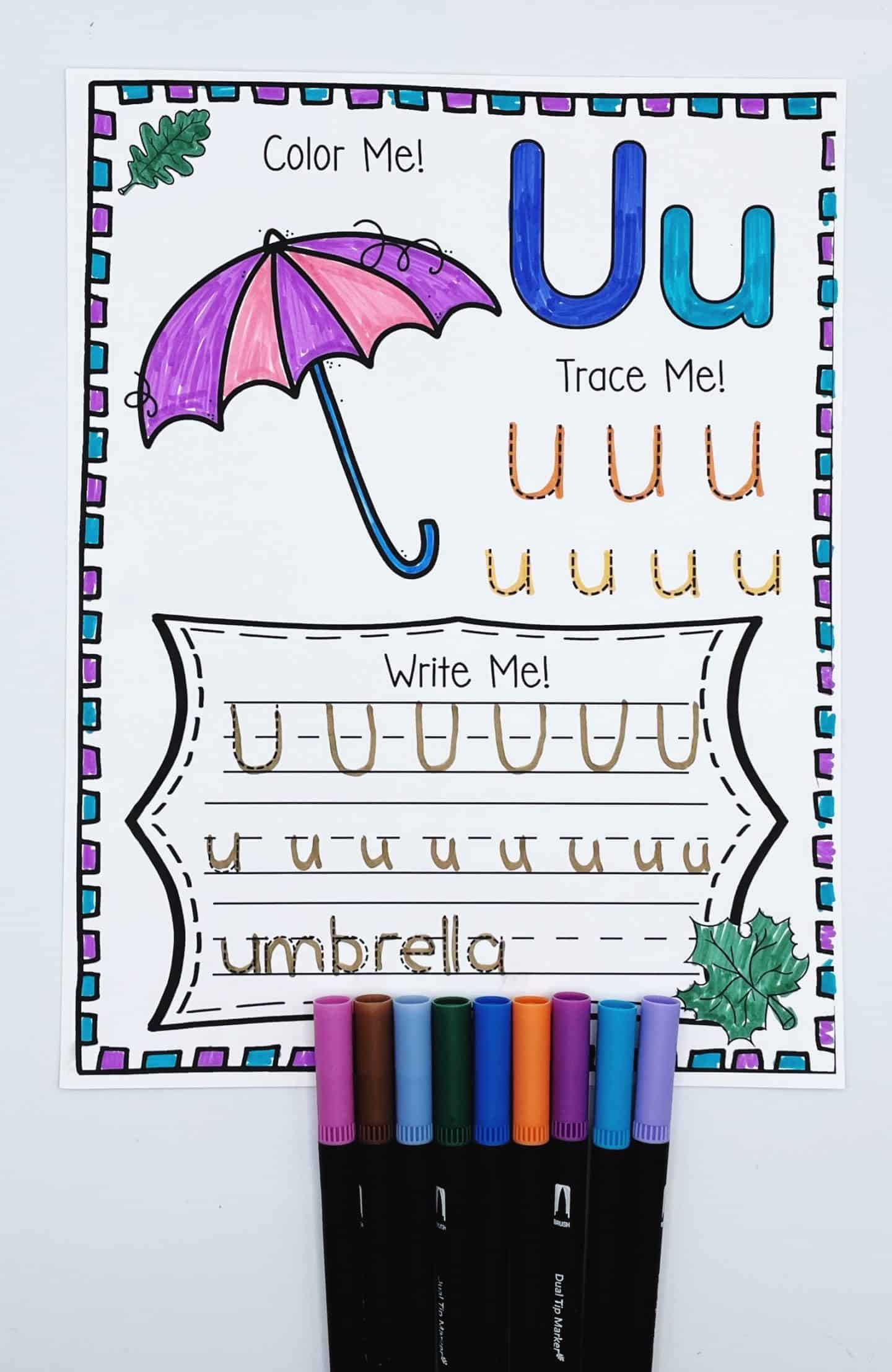 Fall alphabet worksheet for the letter U featuring a coloring activity with an umbrella, uppercase and lowercase U tracing, and writing practice for the word “umbrella.” A seasonal educational printable for early literacy and handwriting skills.