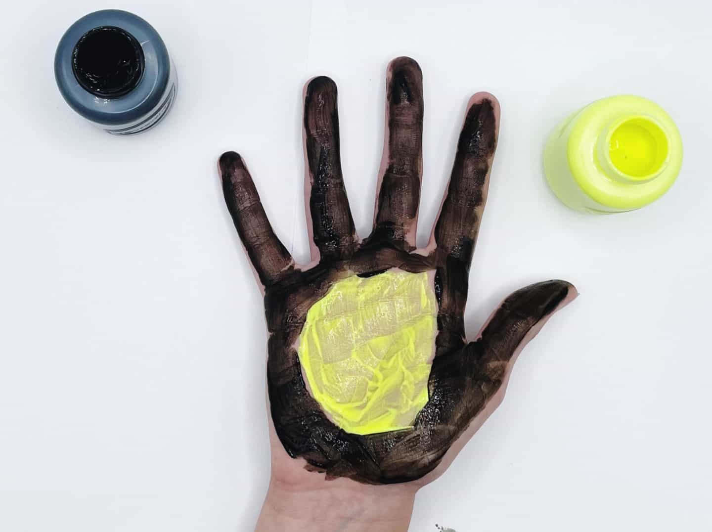 black and yellow handprint
