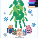 Finished Christmas tree handprint art using green paint on a printable template with gifts and snowflakes.