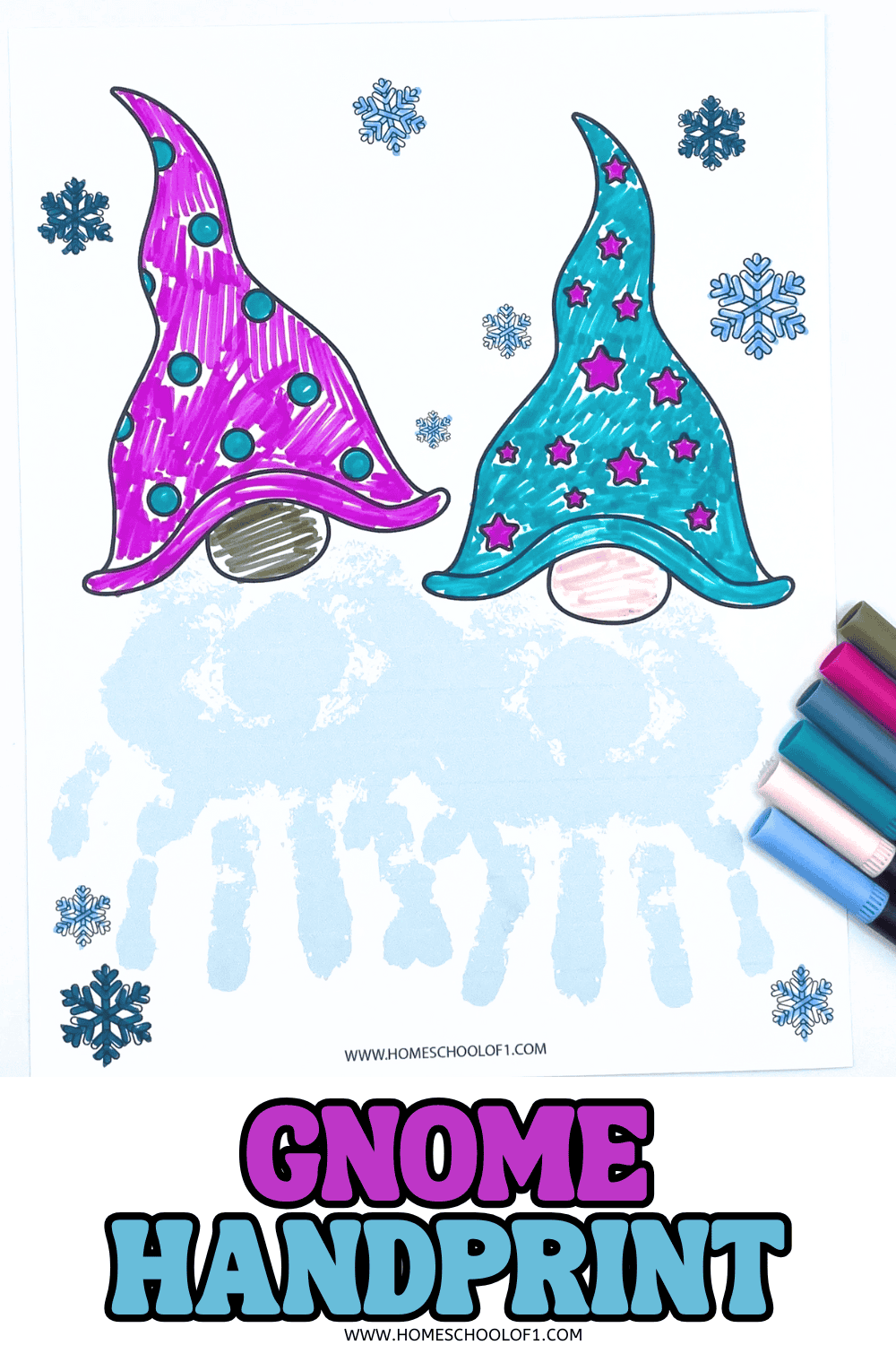 Finished gnome handprint craft with pink and blue gnome hats, handprint beards, and snowflakes

