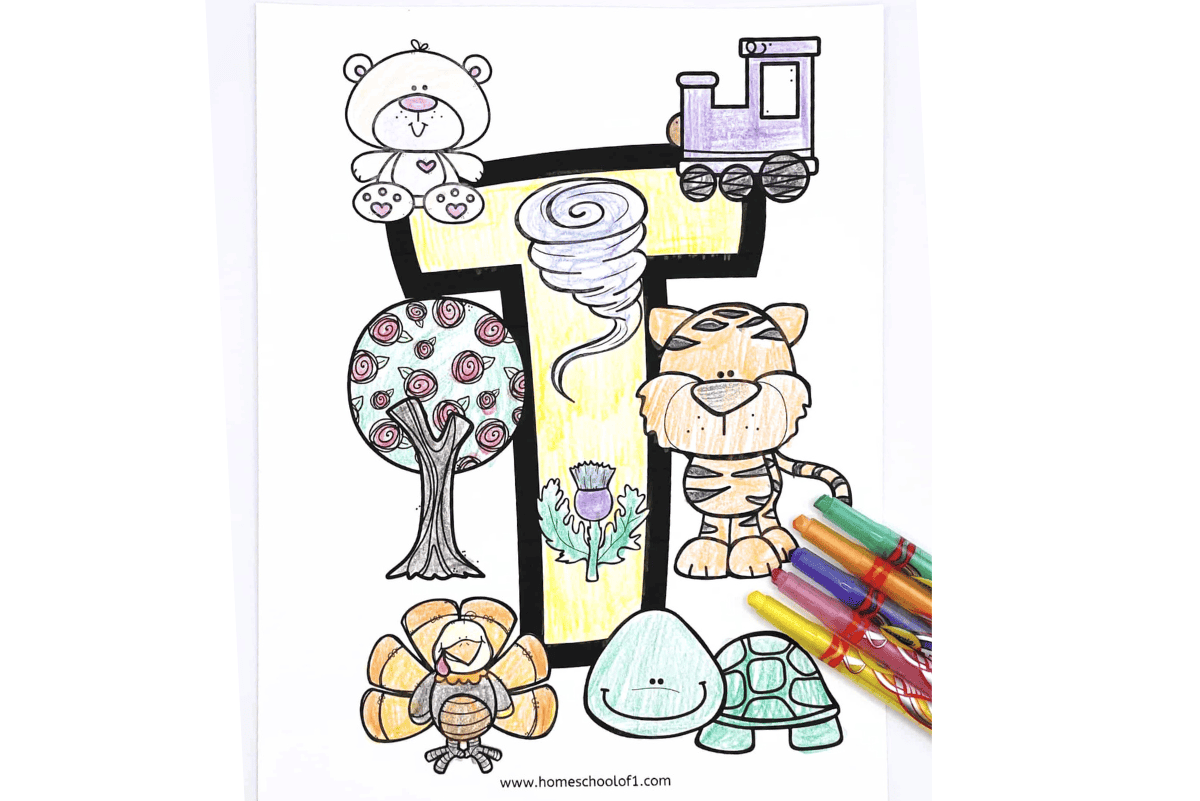 Coloring page of the letter "T" with hand-colored drawings of a teddy bear, train, tree, tornado, tiger, thistle, turkey, and turtle, alongside colorful markers.