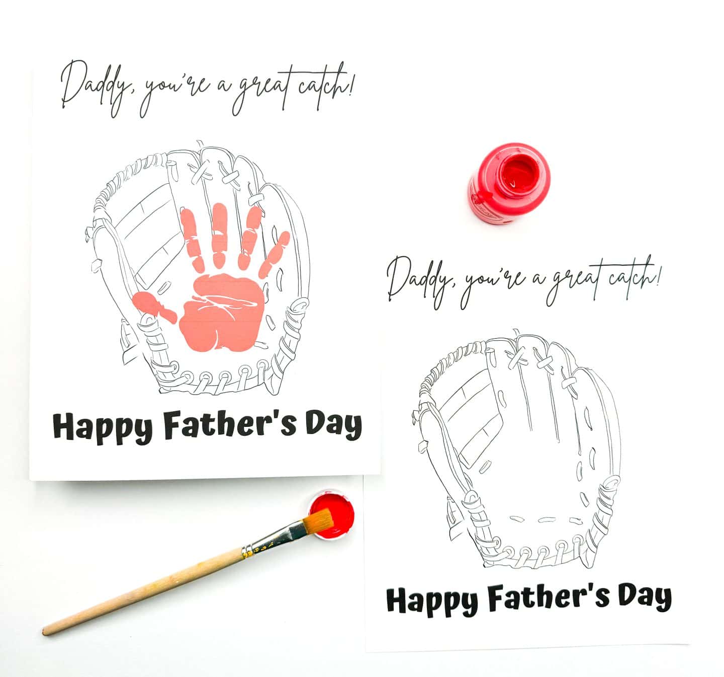 Two Father's Day cards are shown featuring a baseball glove illustration with the message, “Daddy, you’re a great catch!” above and “Happy Father’s Day” below. One card includes a red handprint in the center of the glove, while the other is blank and ready for a print. A red paint bottle and brush are nearby, suggesting a fun craft activity for kids.