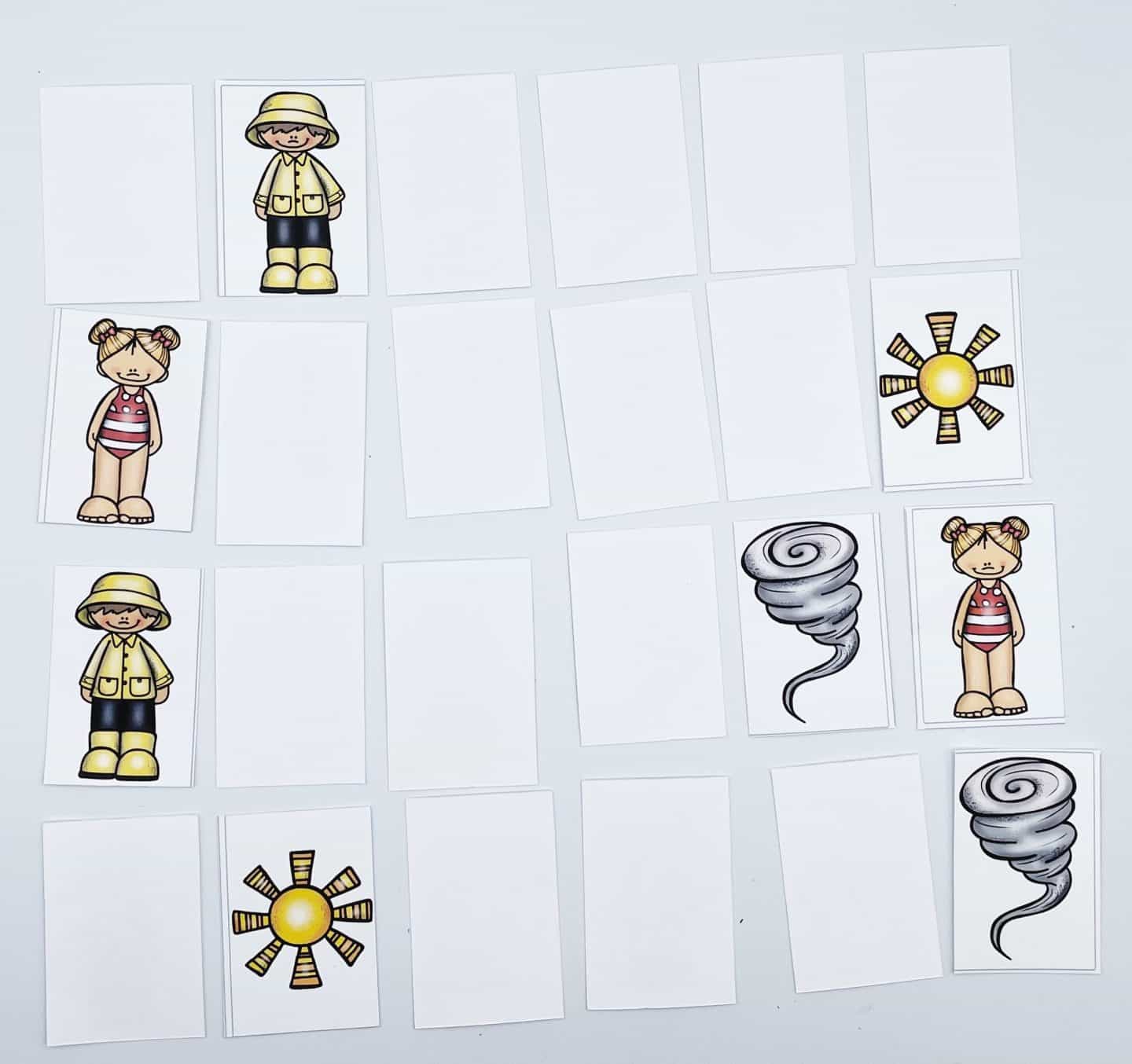Illustration of a memory card game. Cards are laid face up and face down, featuring pairs of images: a cartoon child in a raincoat, a girl in a striped shirt, a sun, and a tornado.
