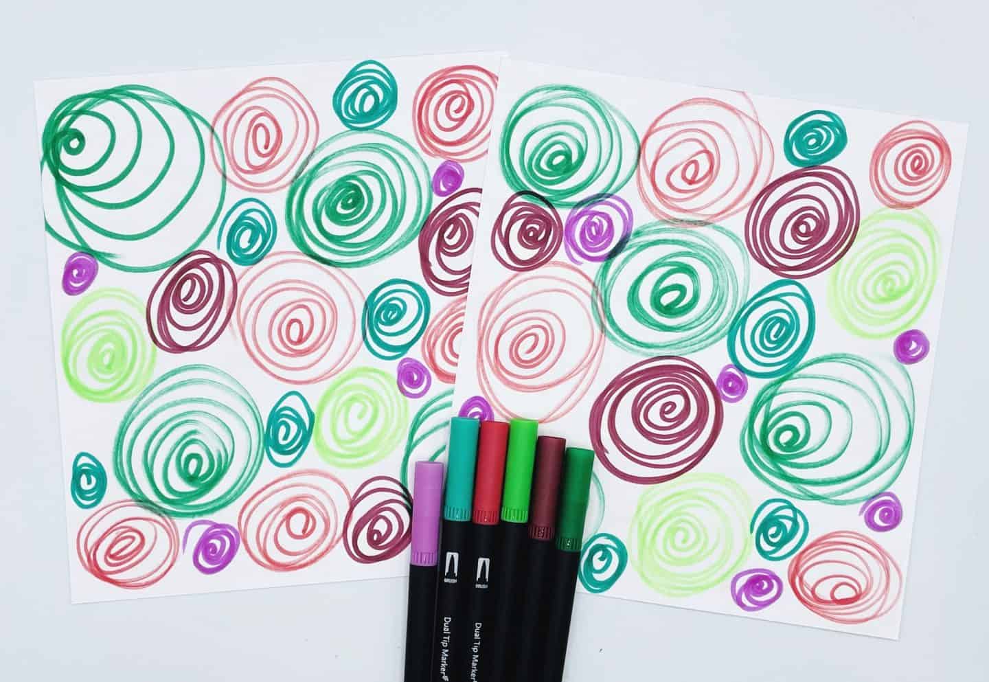 green, red and purple squiggles on the back of the Christmas matching cards