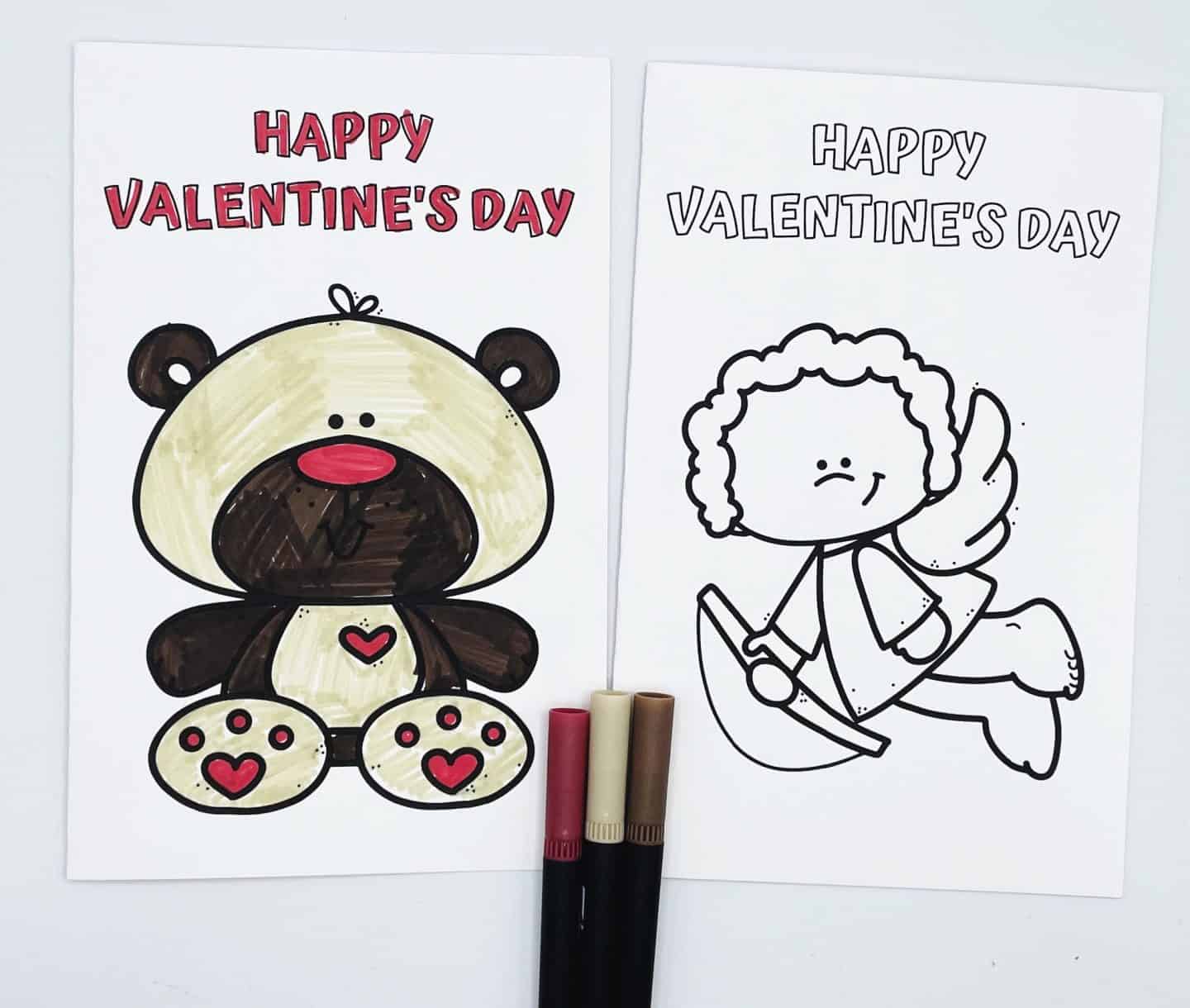 Two Valentine’s Day coloring cards with the text “Happy Valentine’s Day” at the top. The left card is colored and shows a cute teddy bear with tan and dark brown fur, a red nose, and red hearts on its paws and belly. The right card is uncolored and features a chubby-cheeked Cupid character flying with a bow and arrow. Three markers in red and tan shades are placed below the cards.