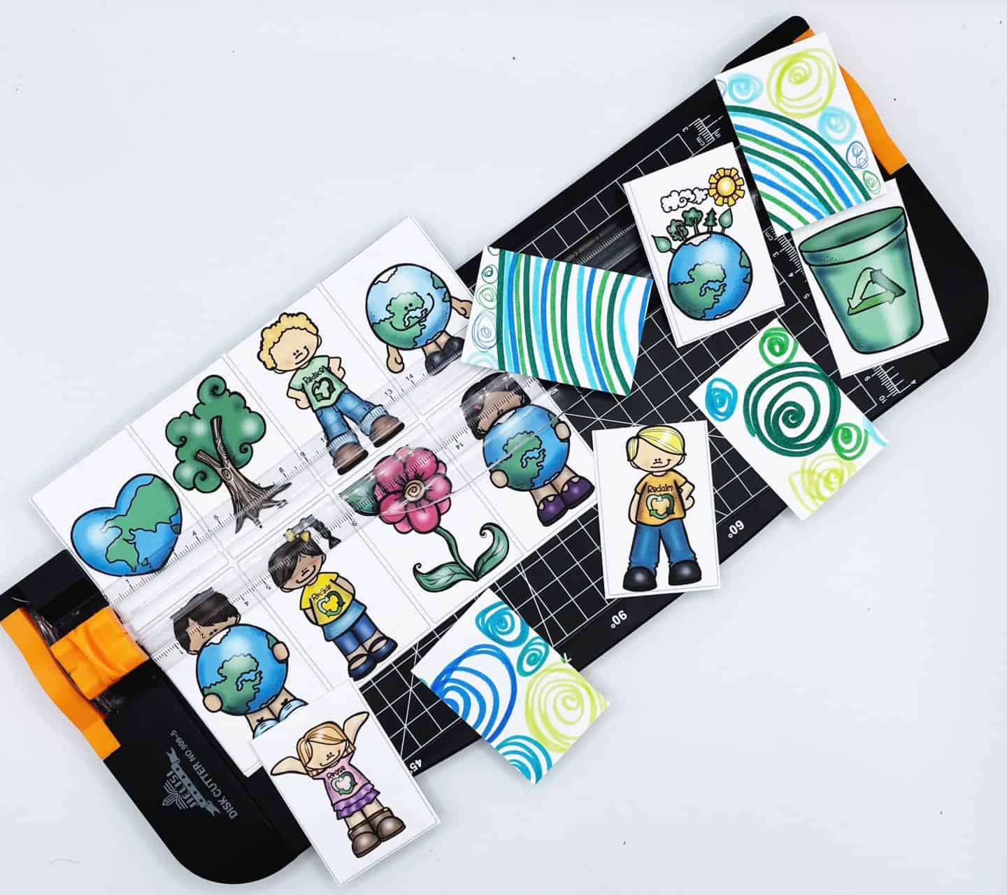 free earth day memory game being cut with a paper cutter