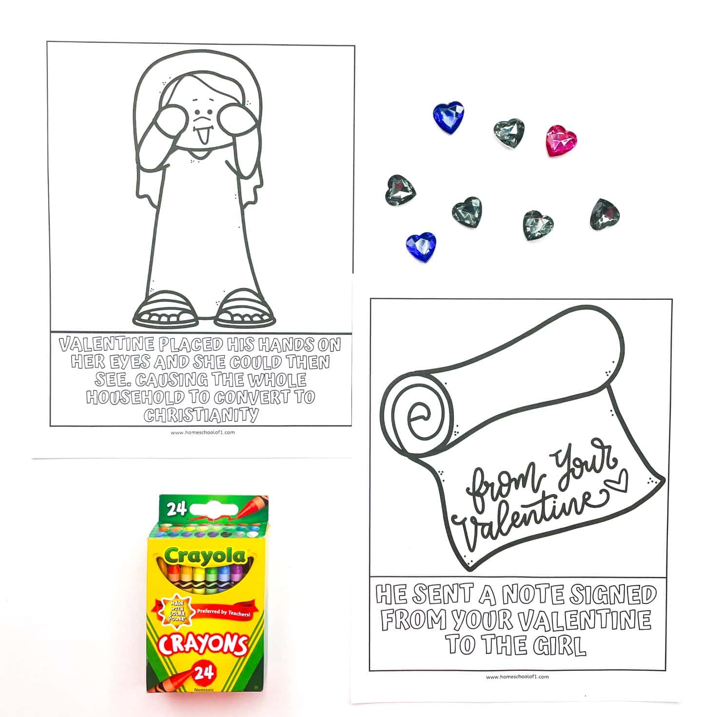 Two uncolored Valentine's Day history worksheets for kids. One page shows a girl with her hands over her eyes and a caption explaining how Valentine healed her blindness, leading her family to convert to Christianity. The other features a scroll with the words “from your Valentine” and a caption about him sending a note to the girl. Decorative heart-shaped gems and a 24-pack of Crayola crayons are also shown.