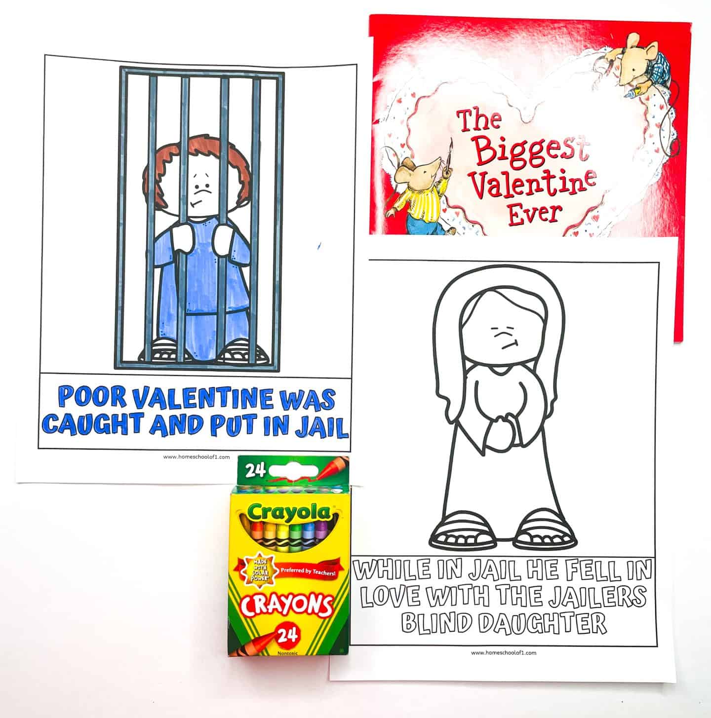 Two Valentine’s Day history coloring pages for kids. One is fully colored and shows Valentine behind jail bars with the caption “Poor Valentine was caught and put in jail.” The other is uncolored, depicting a sad woman with the text “While in jail he fell in love with the jailer’s blind daughter.” Also pictured are a red children’s book titled The Biggest Valentine Ever and a 24-pack of Crayola crayons.
