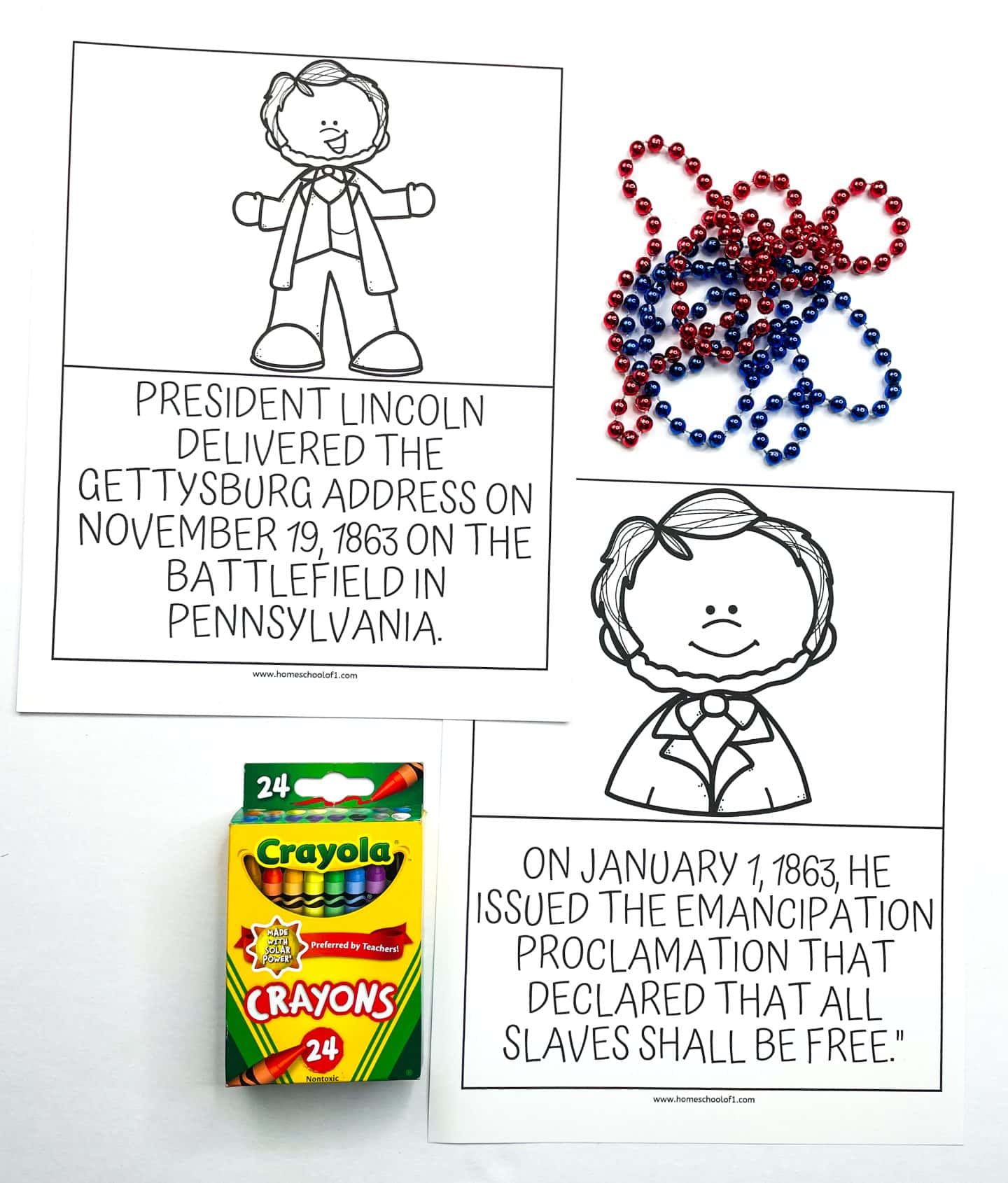 Two Abraham Lincoln worksheets for kids featuring black-and-white cartoon illustrations and historical facts. One highlights the Gettysburg Address delivered on November 19, 1863, and the other covers the Emancipation Proclamation issued on January 1, 1863. The image also includes red and blue beaded necklaces and a 24-pack of Crayola crayons for a hands-on learning touch.