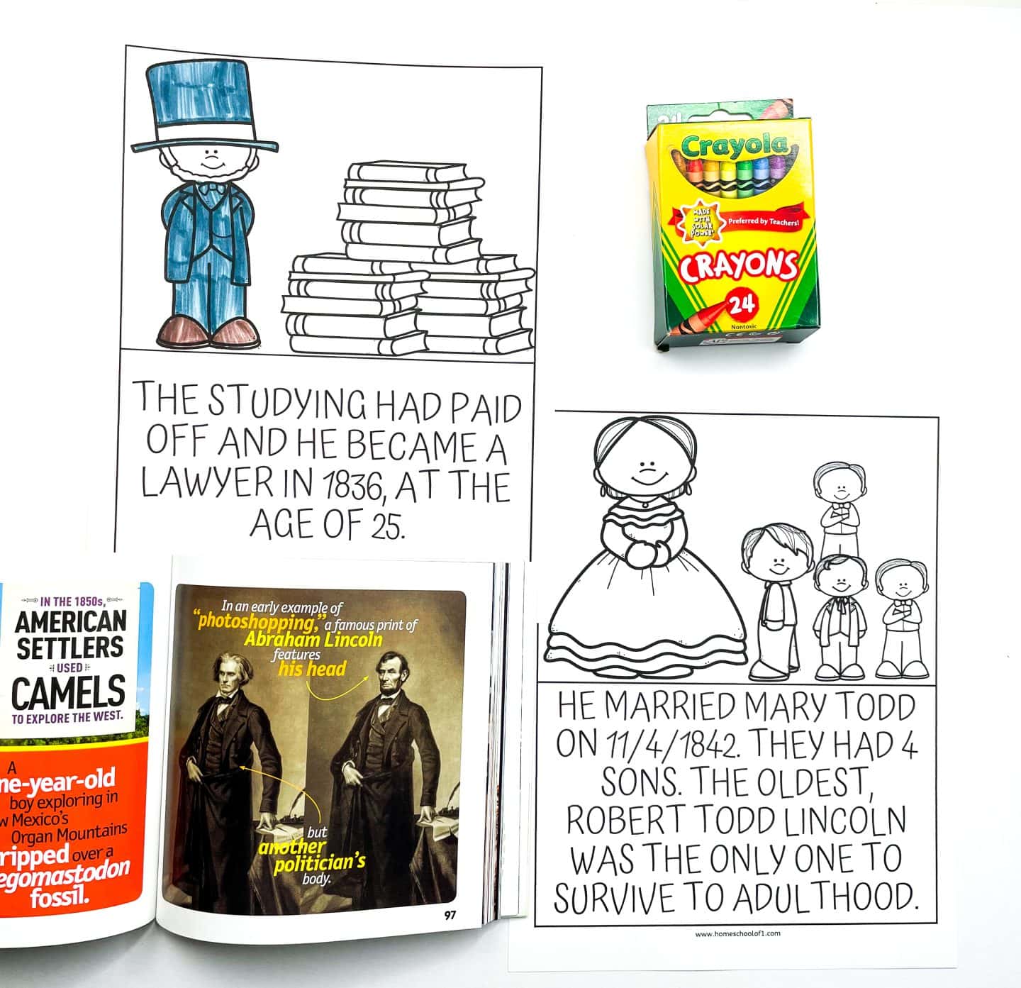 Flat lay of Abraham Lincoln worksheets for kids, including one that states he became a lawyer at age 25 in 1836, and another that explains he married Mary Todd and had four sons, with only Robert Todd Lincoln surviving to adulthood. The worksheets feature partially colored illustrations of Lincoln, stacks of books, and his family. Also shown are a box of Crayola crayons and a children's magazine open to a fact about a photoshopped image of Abraham Lincoln.