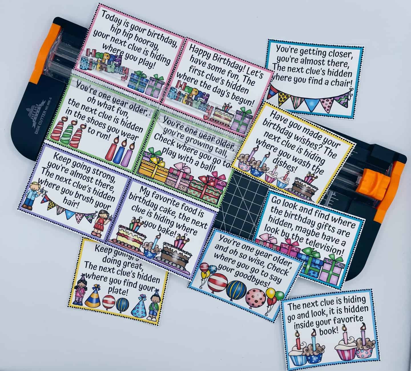 A sheet of colorful birthday scavenger hunt clues being cut with a paper trimmer. Each printable clue features a fun rhyme and festive illustrations like cakes, balloons, presents, and party hats. These birthday scavenger hunt clues guide kids to hidden surprises around the house, making them perfect for a playful and memorable birthday celebration.