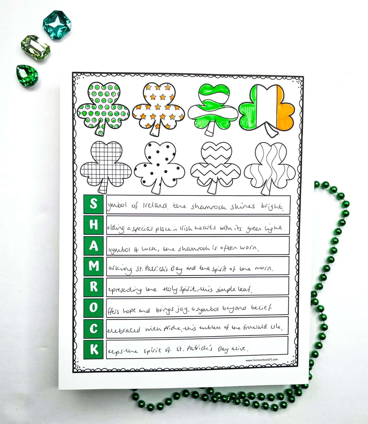 Shamrock acrostic poem worksheet with patterned clovers and a completed student example