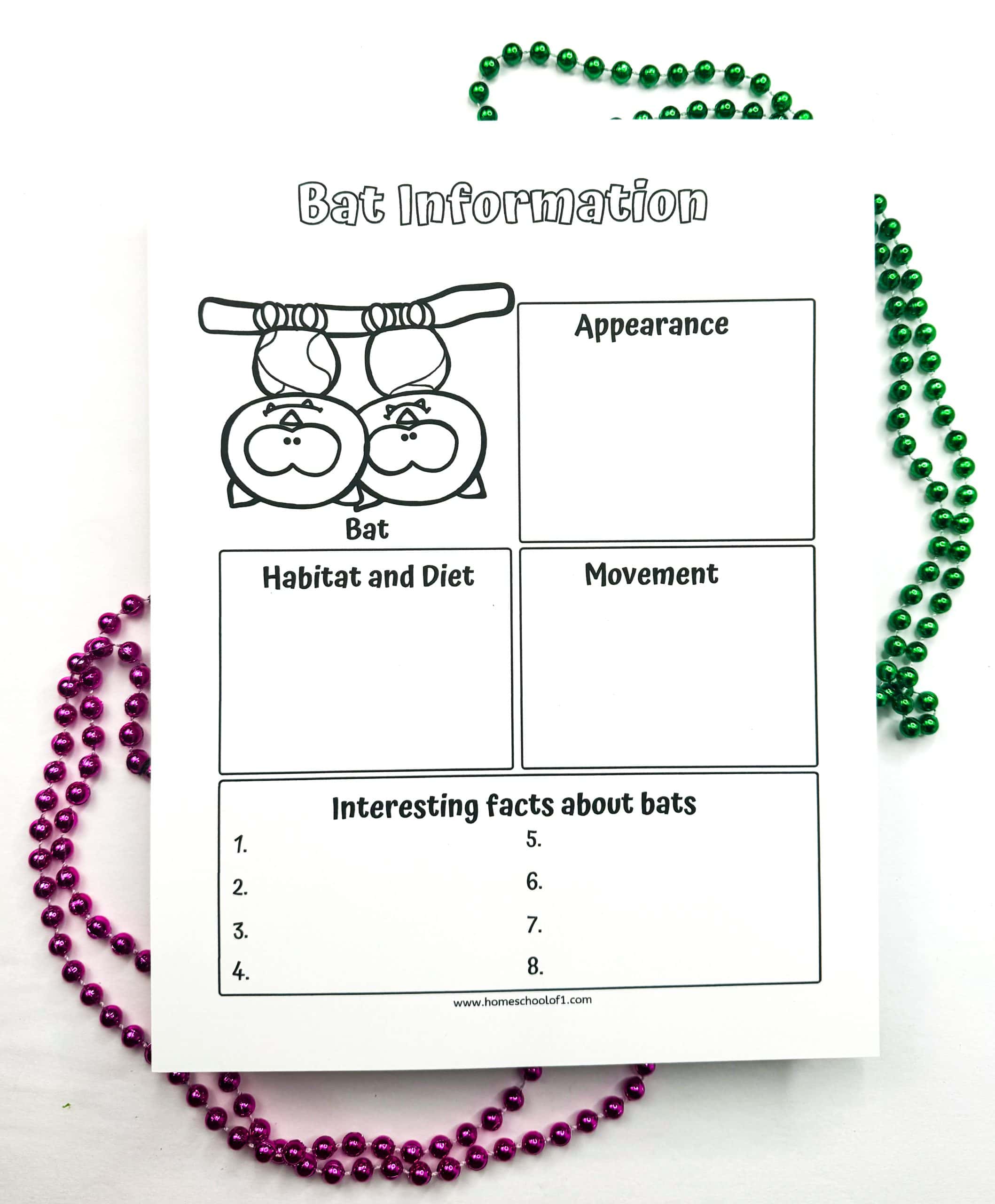 Printable bat-themed worksheet for kids with sections on appearance, habitat, movement, and fun facts, plus a cartoon of two bats hanging upside down.