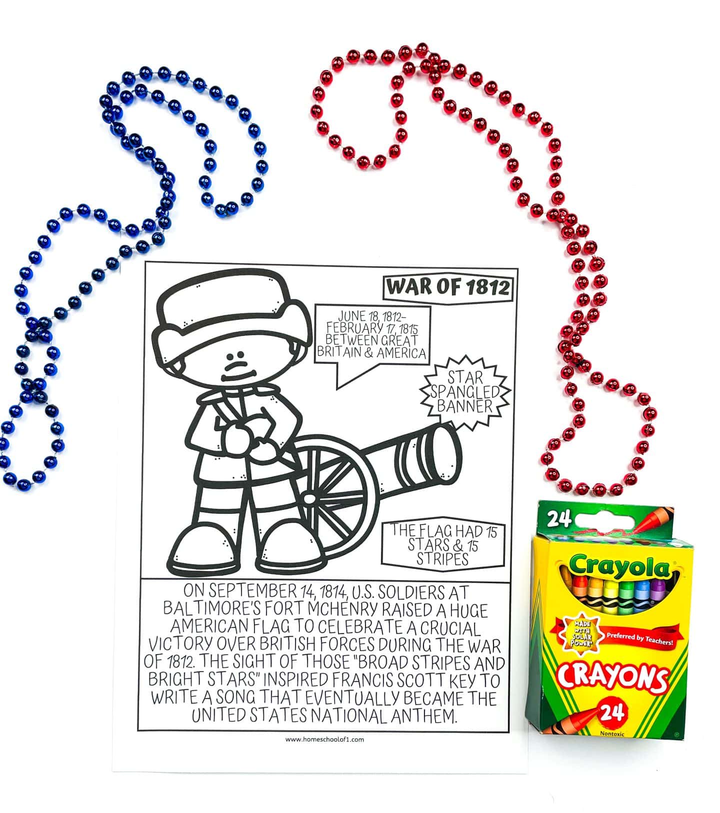 A black-and-white coloring page about the War of 1812, featuring a cartoon soldier next to a cannon. The page highlights key facts, including the war dates (1812–1815), and the inspiration for the U.S. national anthem, “The Star-Spangled Banner.” The bottom text describes how the flag with 15 stars and stripes flown at Fort McHenry inspired Francis Scott Key. Red and blue bead necklaces and a 24-pack of Crayola crayons are placed around the page.