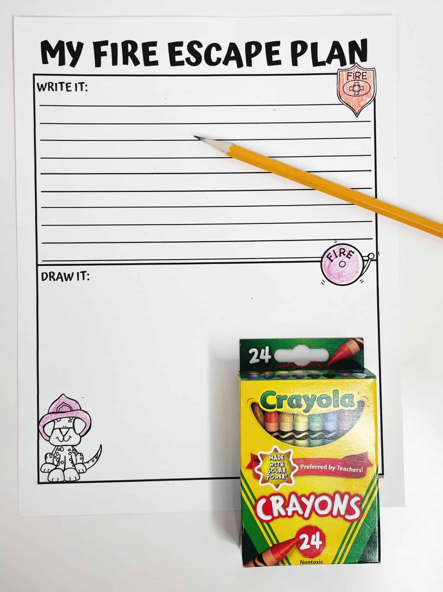 A "My Fire Escape Plan" worksheet with sections for children to write and draw their fire escape plan. The worksheet includes a fire department shield and a fire alarm illustration. A yellow pencil is placed beside the worksheet, with Crayola crayons visible in the background. A cute illustration of a Dalmatian dog wearing a firefighter hat is shown in the lower left corner. The worksheet is designed with a dotted border and has lines for children to fill in their answers