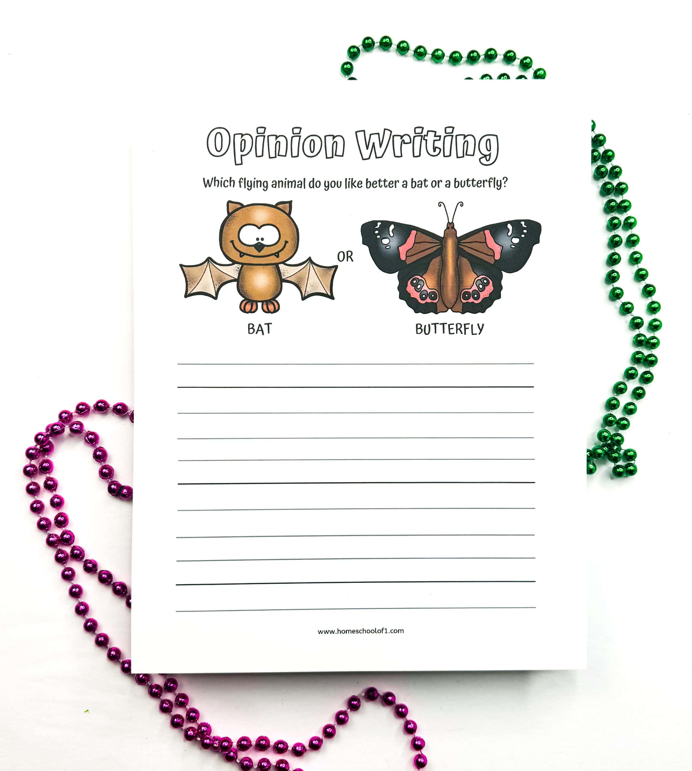 Printable opinion writing worksheet for kids with cartoon images of a bat and a butterfly, asking which one they prefer. Includes lined space for writing.