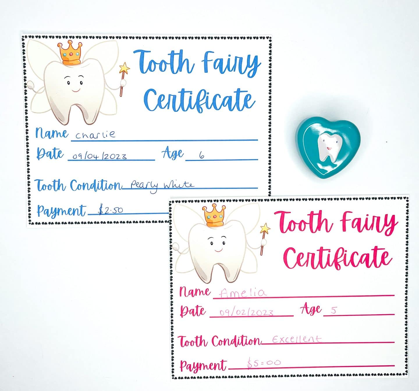 Two Tooth Fairy certificates for children named Charlie and Amelia, detailing the loss of a tooth, with fields for the child's name, date, age, tooth condition, and payment. One certificate shows a filled out example with the condition as 'pearly white' and payment of '$2.50'. Adjacent to the certificates is a Tooth Fairy box with a bright blue heart and a smiling tooth inside.