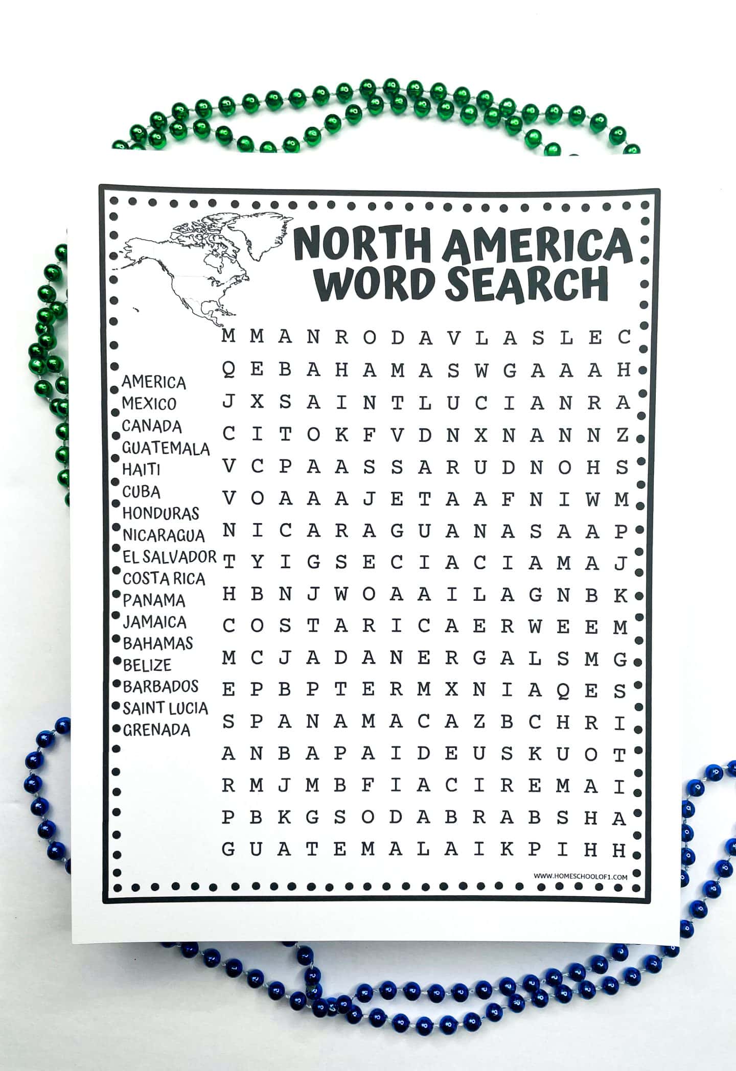 A black and white printable worksheet titled “North America Word Search” featuring a large word search grid and a list of country names including America, Mexico, Canada, Guatemala, and more. A small outline map of North America is in the top left corner. The sheet is bordered by green and blue bead necklaces.