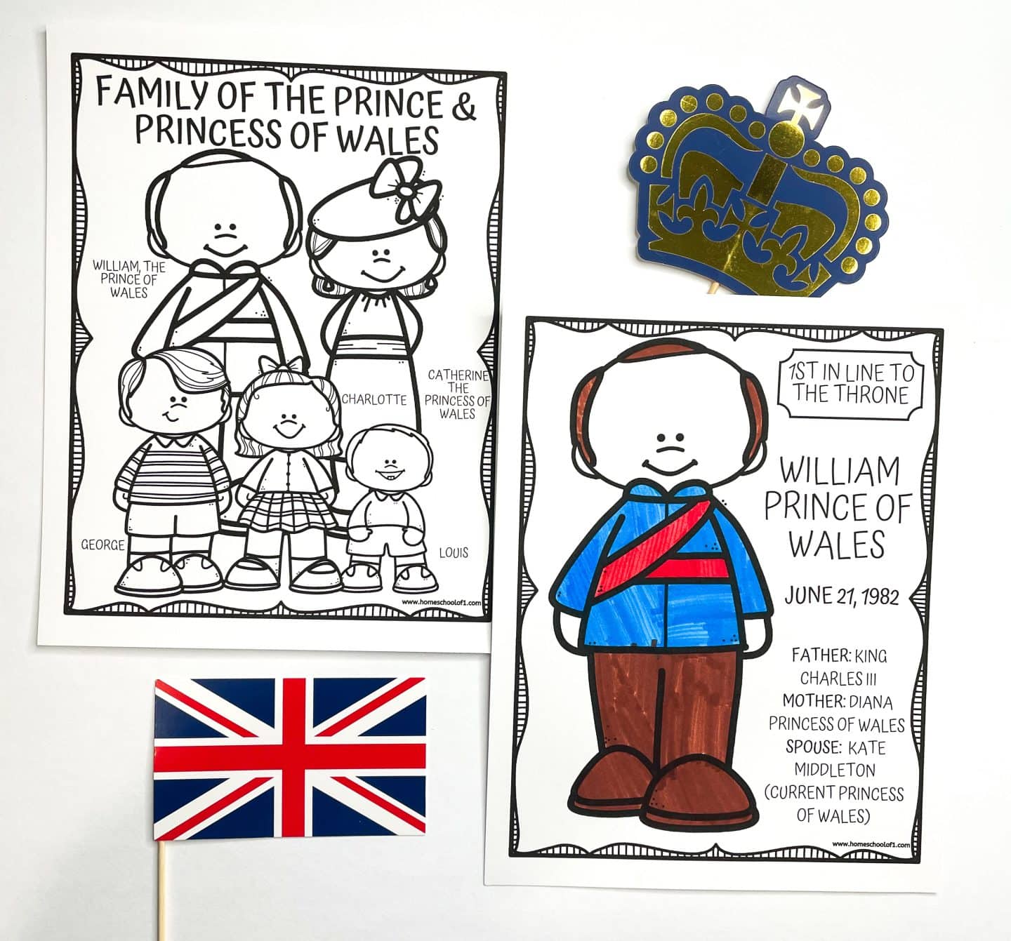 Two printable coloring pages feature members of the British royal family. The first shows cartoon-style illustrations of William and Catherine, the Prince and Princess of Wales, along with their children George, Charlotte, and Louis, with names labeled. The second page, partially colored, spotlights William, Prince of Wales, noted as “1st in Line to the Throne” with his birthdate and family details. A Union Jack flag and a blue and gold paper crown are also included in the display.